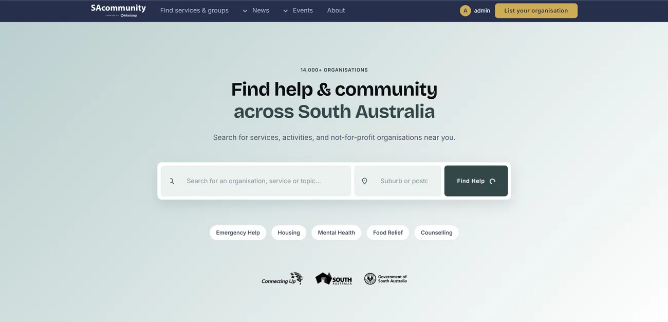 The redesigned SAcommunity.org site on desktop: a clean pale-blue hero with a large search bar for finding organisations, services and topics, quick links for Emergency Help, Housing, Mental Health, Food Relief and Counselling, and partner logos below.